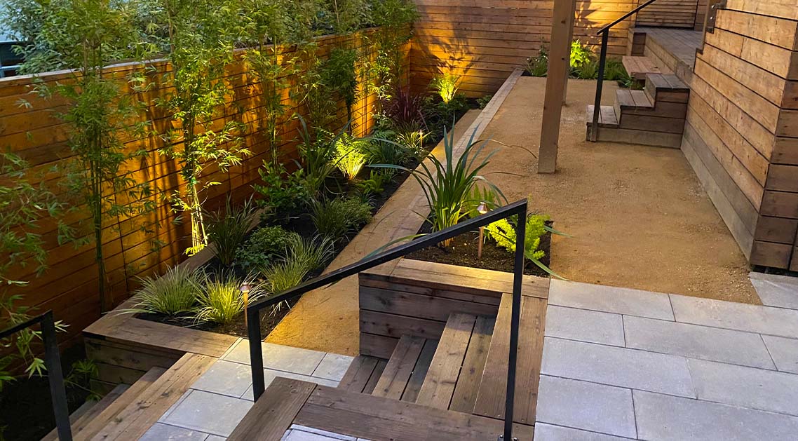 back yard with multi-level architectural terraces, steps and built-in planter beds